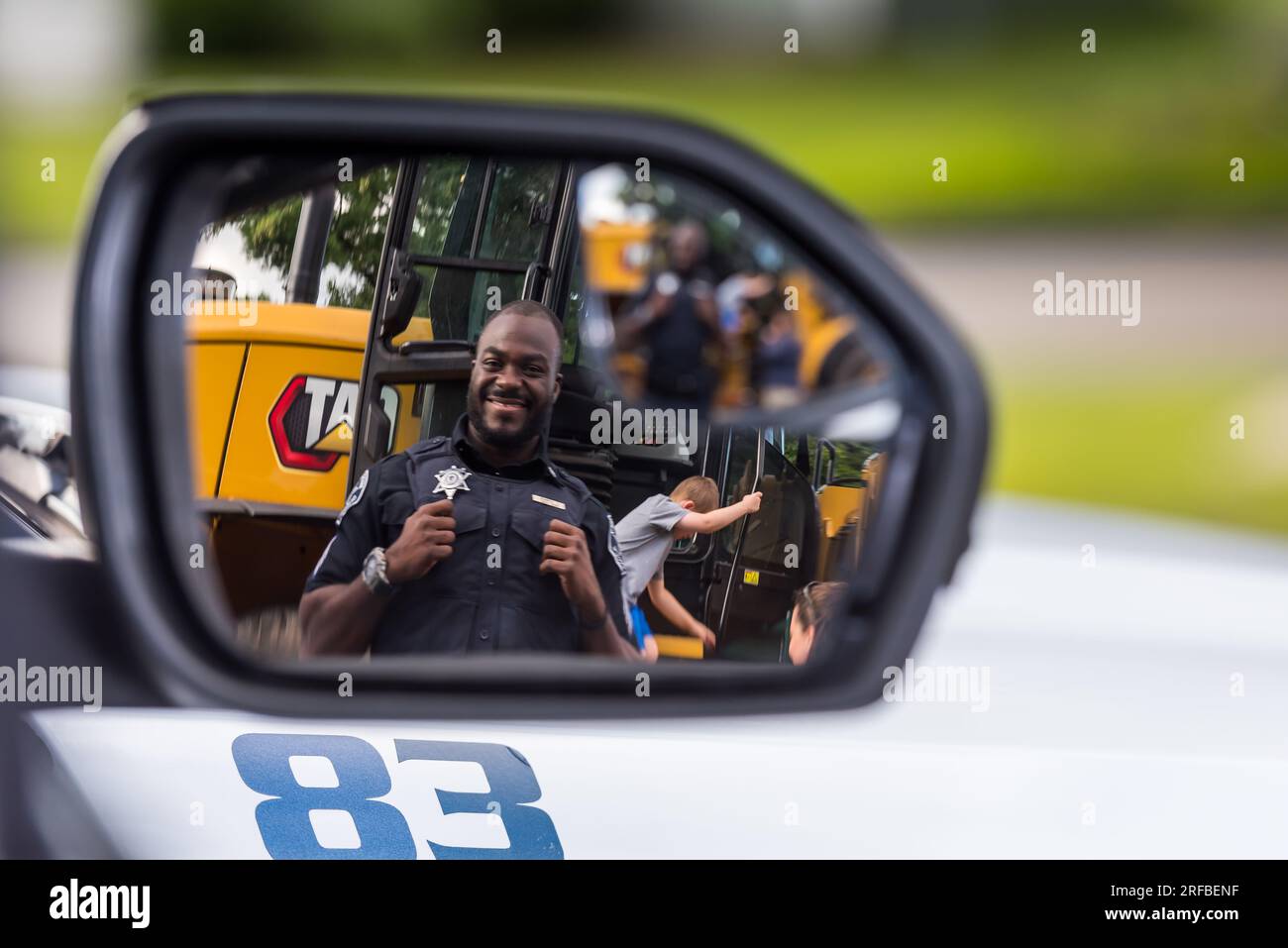 Police Officer from Middlesex Sheriff’s Office seen in car’s rear view