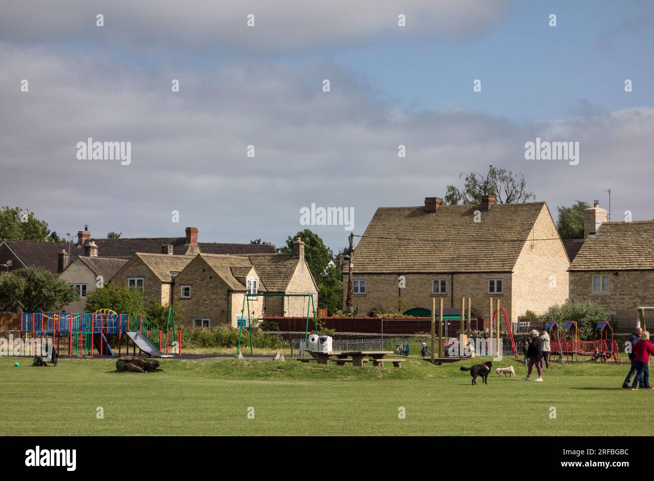 Cottages on the edge of Tetbury Memorial Recreational Ground, Tetbury, Gloucestershire, UK Stock Photo
