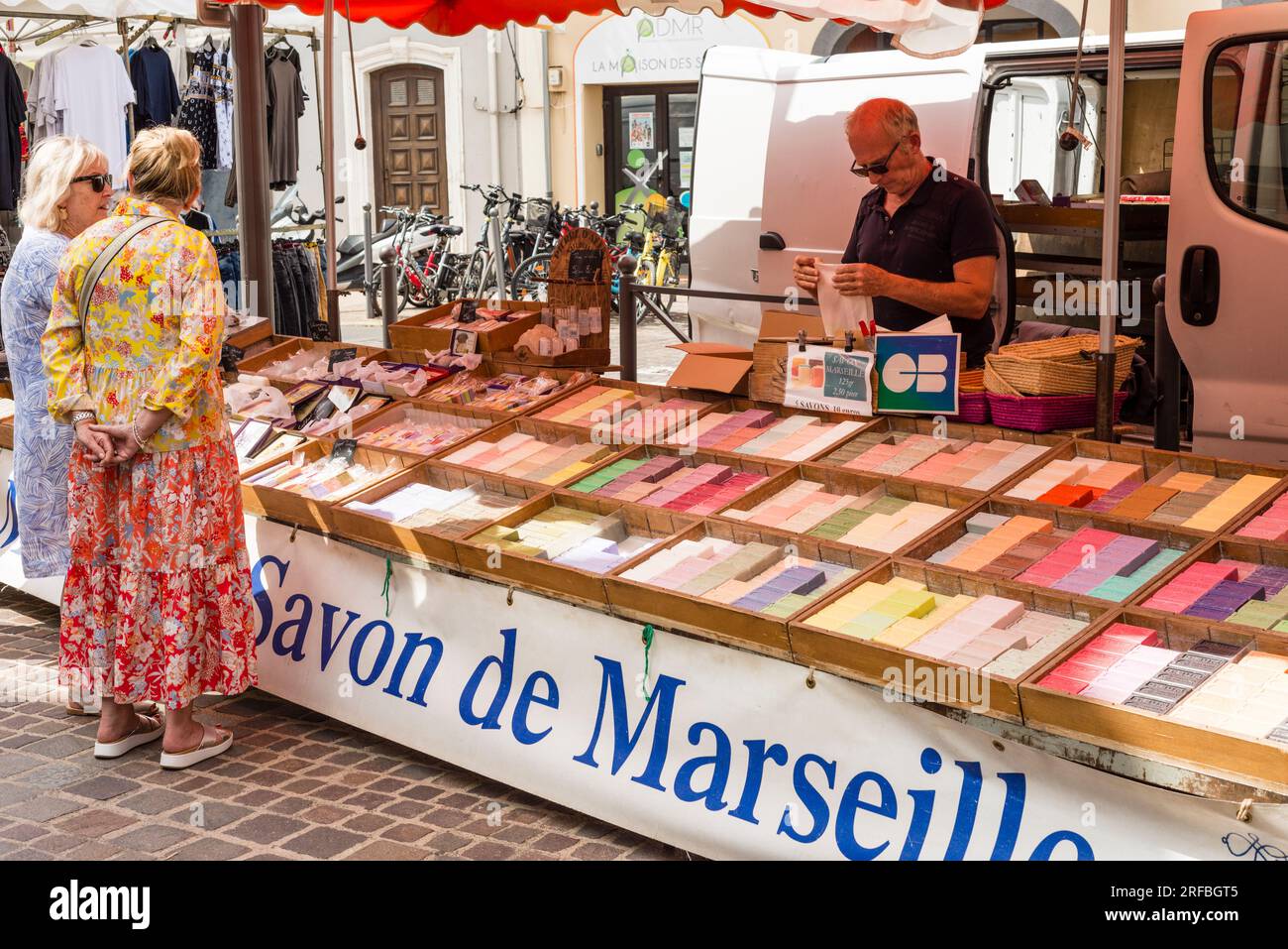 Street market stall selling Marseille Soaps, Marseillan, Herault, Occitanie, France Stock Photo