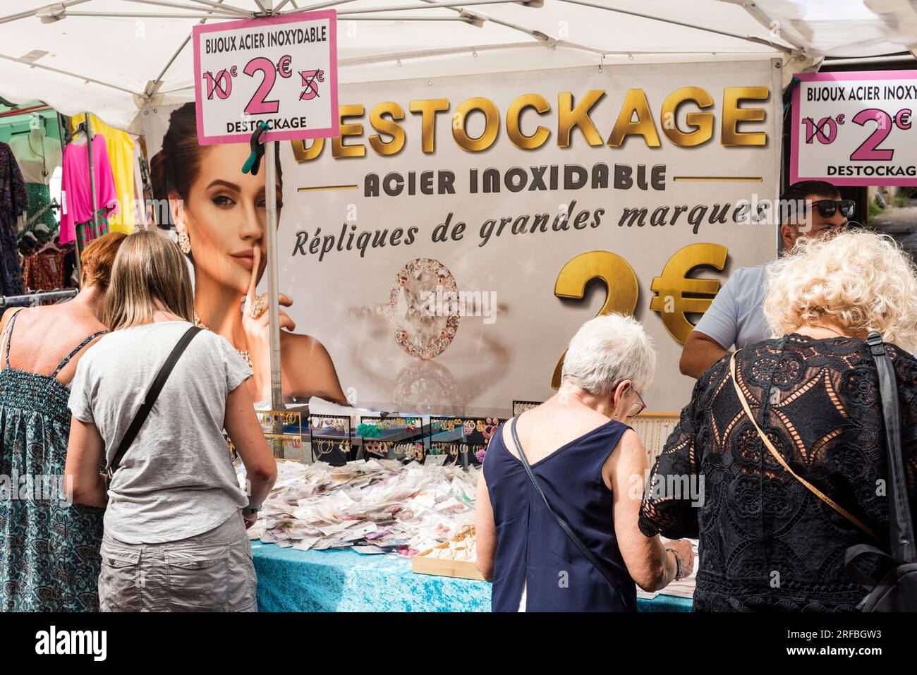 Street market stall offering stock clearance, Marseillan, Herault, Occitanie, France Stock Photo