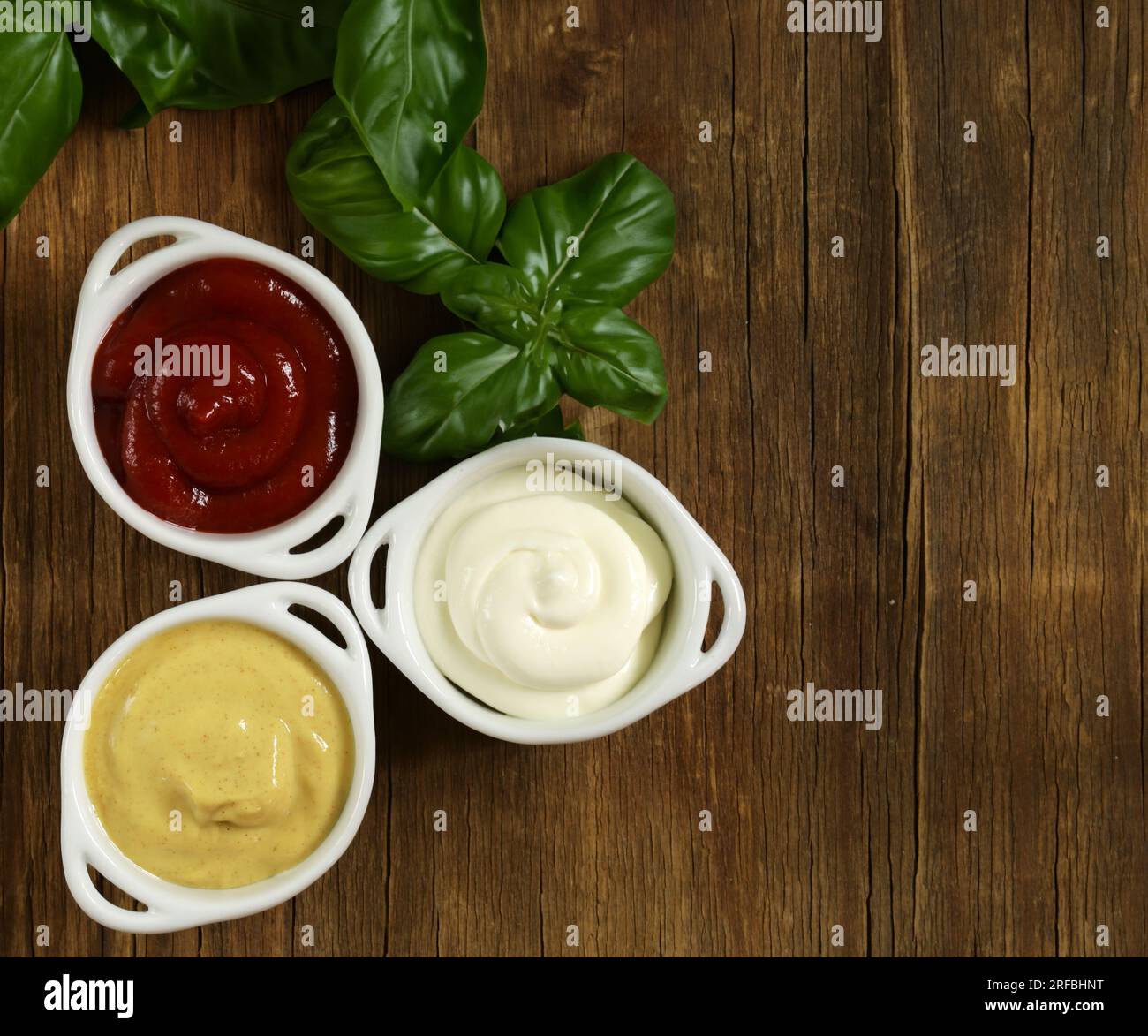 three types of sauces ketchup, mayonnaise and mustard Stock Photo - Alamy