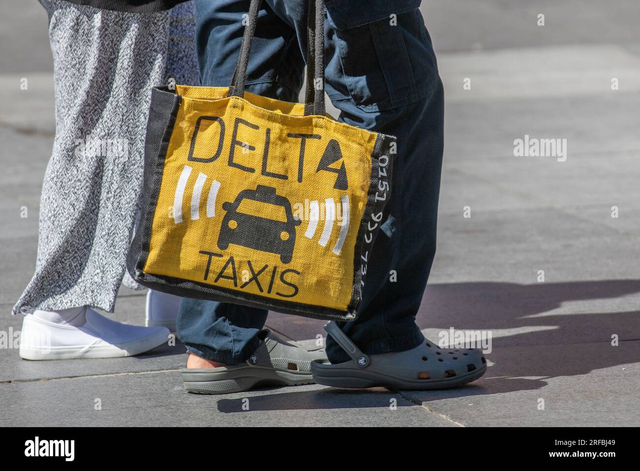 Jute 'Bag for Life' advertising Delta Taxis, licensed taxi, minicab & cab companies, logistic services, airport transfers, minbus hire carriers in Preston, UK Stock Photo