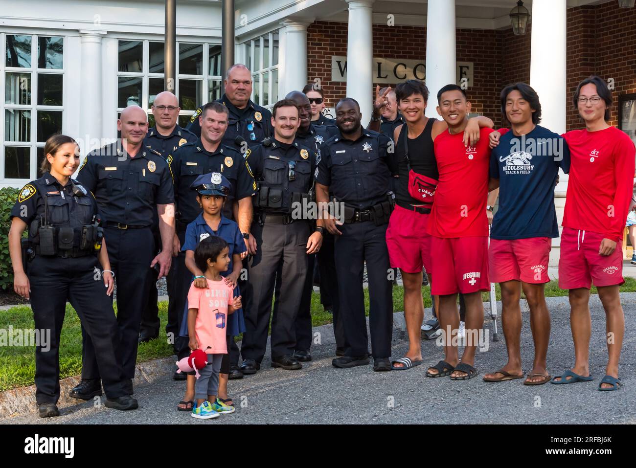Acton Police officers posing with children in the community at the