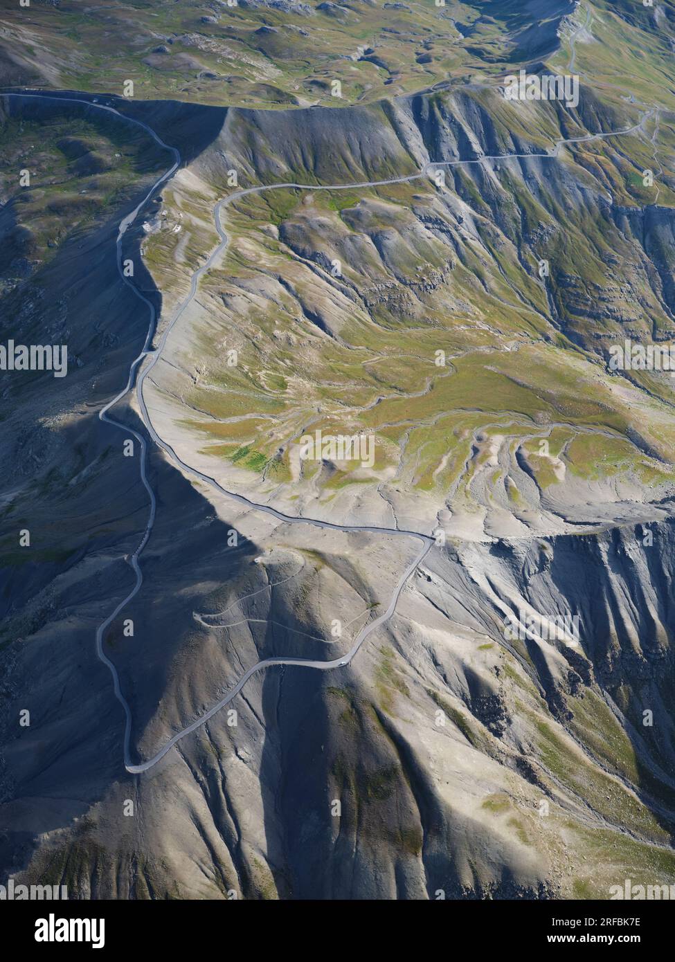 AERIAL VIEW. Col de la Bonette (2715m) with the scenic loop reaching 2802m and circling the Cime de la Bonette (2860m). Mercantour National Park. Stock Photo