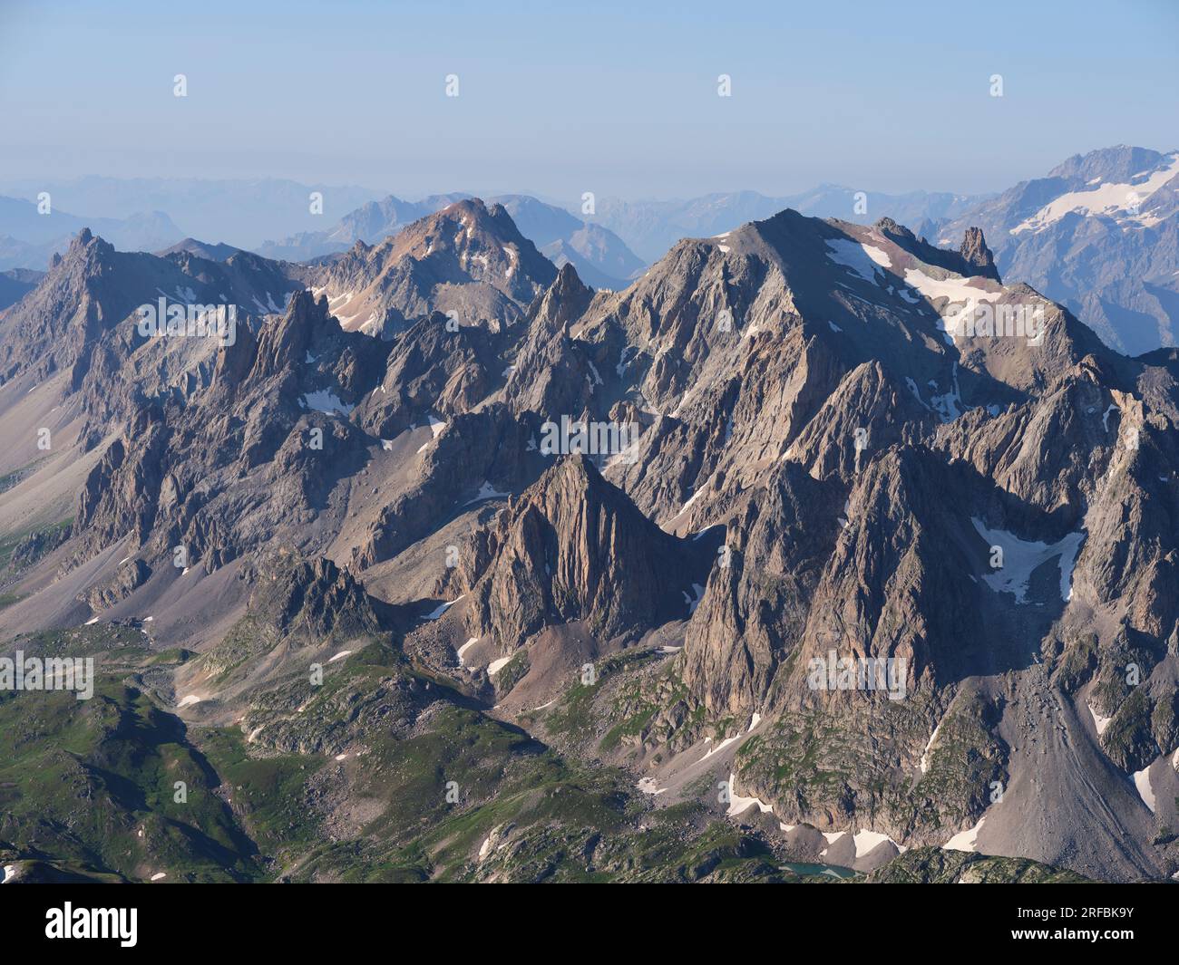 AERIAL VIEW. Cerces Massif in the morning light viewed from the north. Névache, Hautes-Alpes, Provence-Alpes-Côte d'Azur, France. Stock Photo