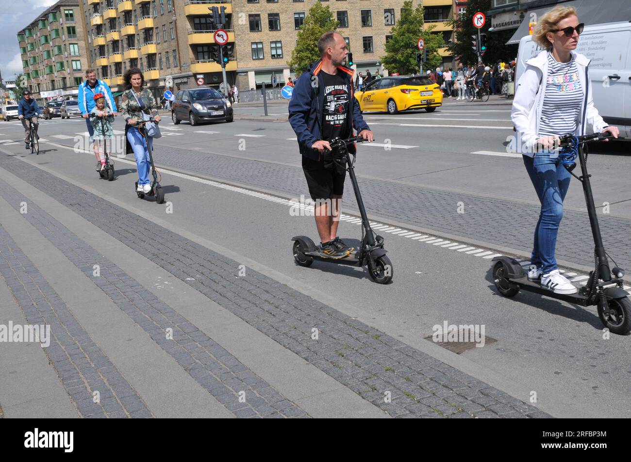 02 August 2023/Persons ride electric scooter in danish capital Copenhagen  Denmark.. (Photo.Francis Joseph Dean/Dean Pictures Stock Photo - Alamy