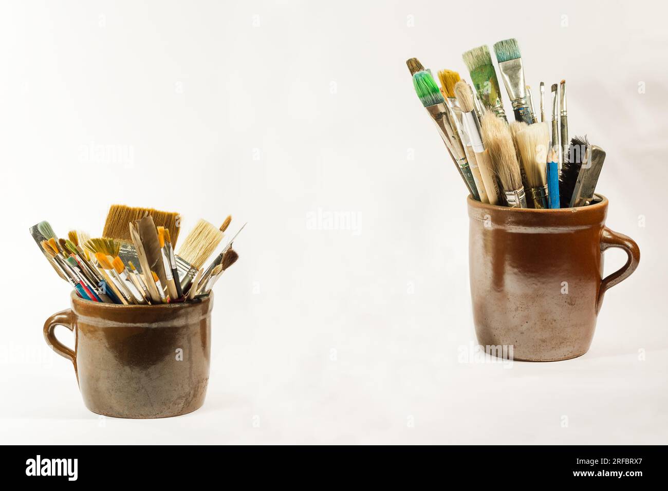 Paint Pots And Brushes On Paint Spattered Worktop Closeup High-Res Stock  Photo - Getty Images
