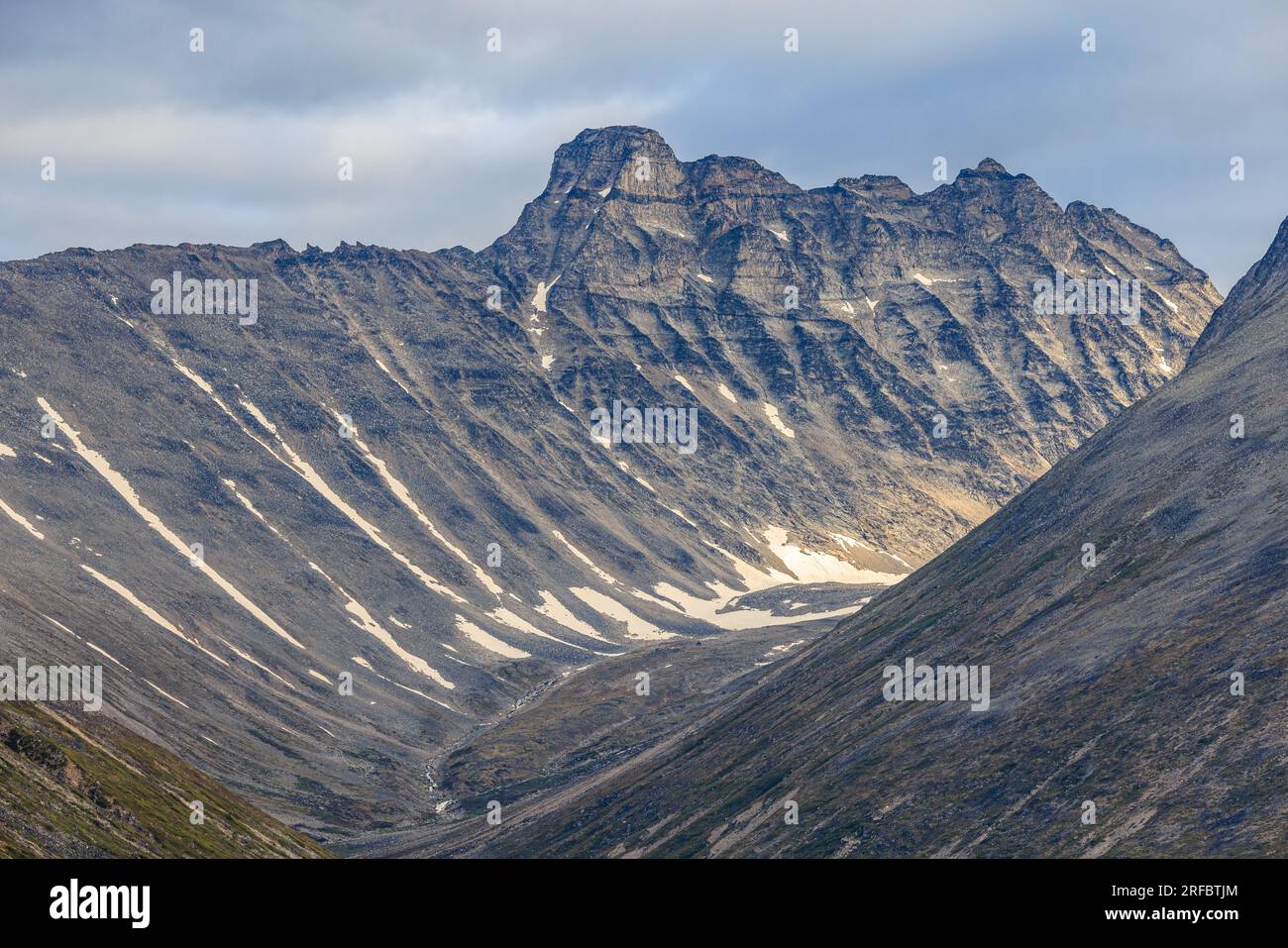 aerial photo of rocky mountain peaks with steep sides forming a v shaped vallel off tasermiut fjord greenland Stock Photo