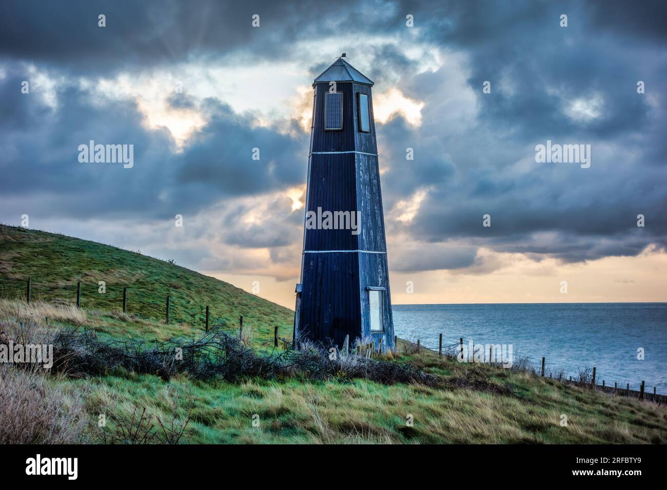 The Samphire Tower by Jony Easterby and Pippa Taylor, Samphire Hoe nature reserve country park, Dover, with a dark moody sky Stock Photo