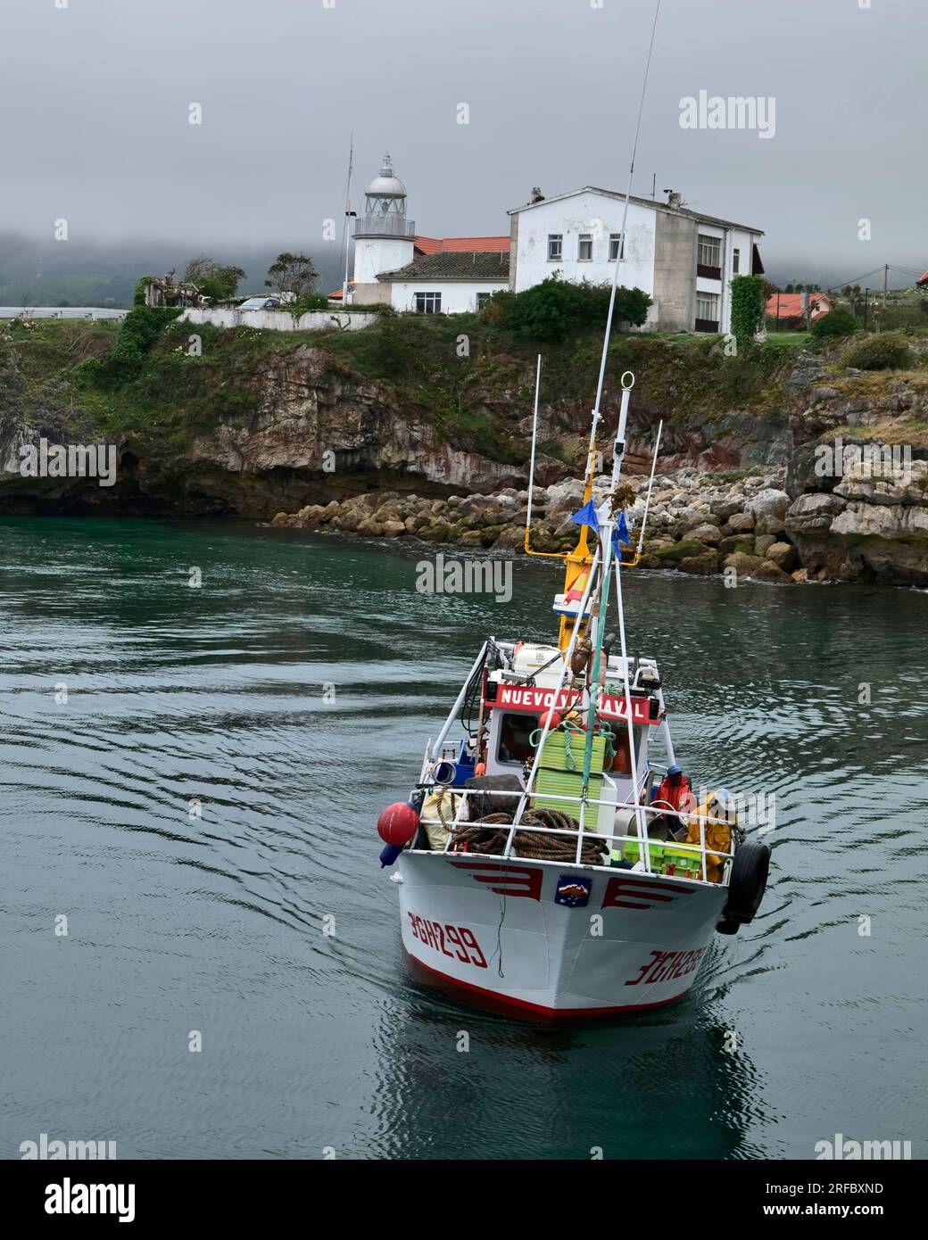 inshore fishing boat returns to harbour, Llanes,Asturias, Costa Verde 
