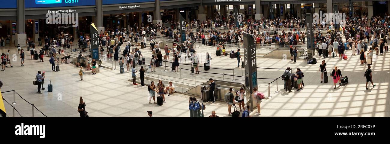 Travelers crowd the Moynihan Train Hall in Pennsylvania Station in New York on Thursday, July 27, 2023, getting an early start to a summer weekend. (© Richard B. Levine) Stock Photo