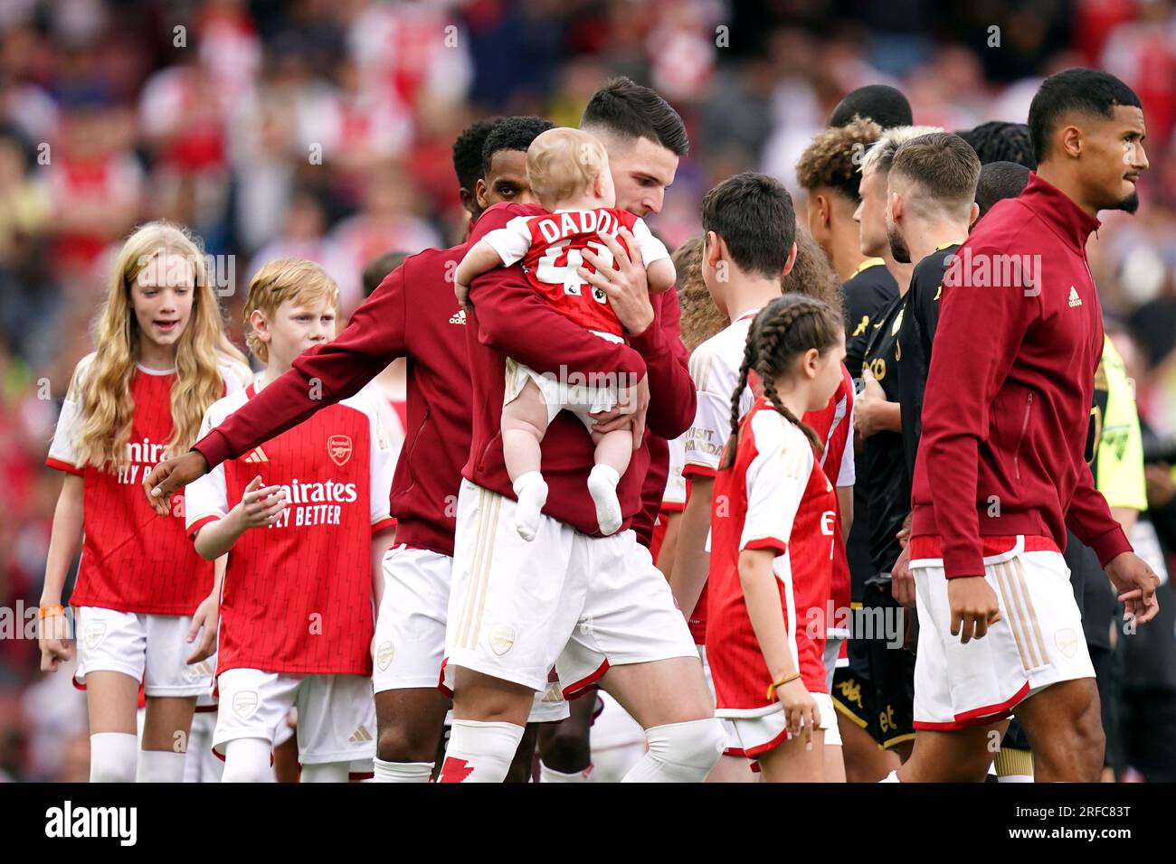 Arsenal's Declan Rice with his son (centre) before the pre-season ...