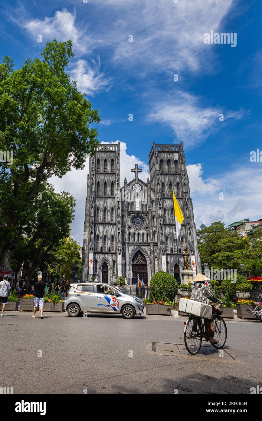 Hanoi, Vietnam - May 28, 2023: St. Joseph's Cathedral, a divine masterpiece in Hanoi, captivates with its Neo Gothic beauty, soaring spires, and intri Stock Photo