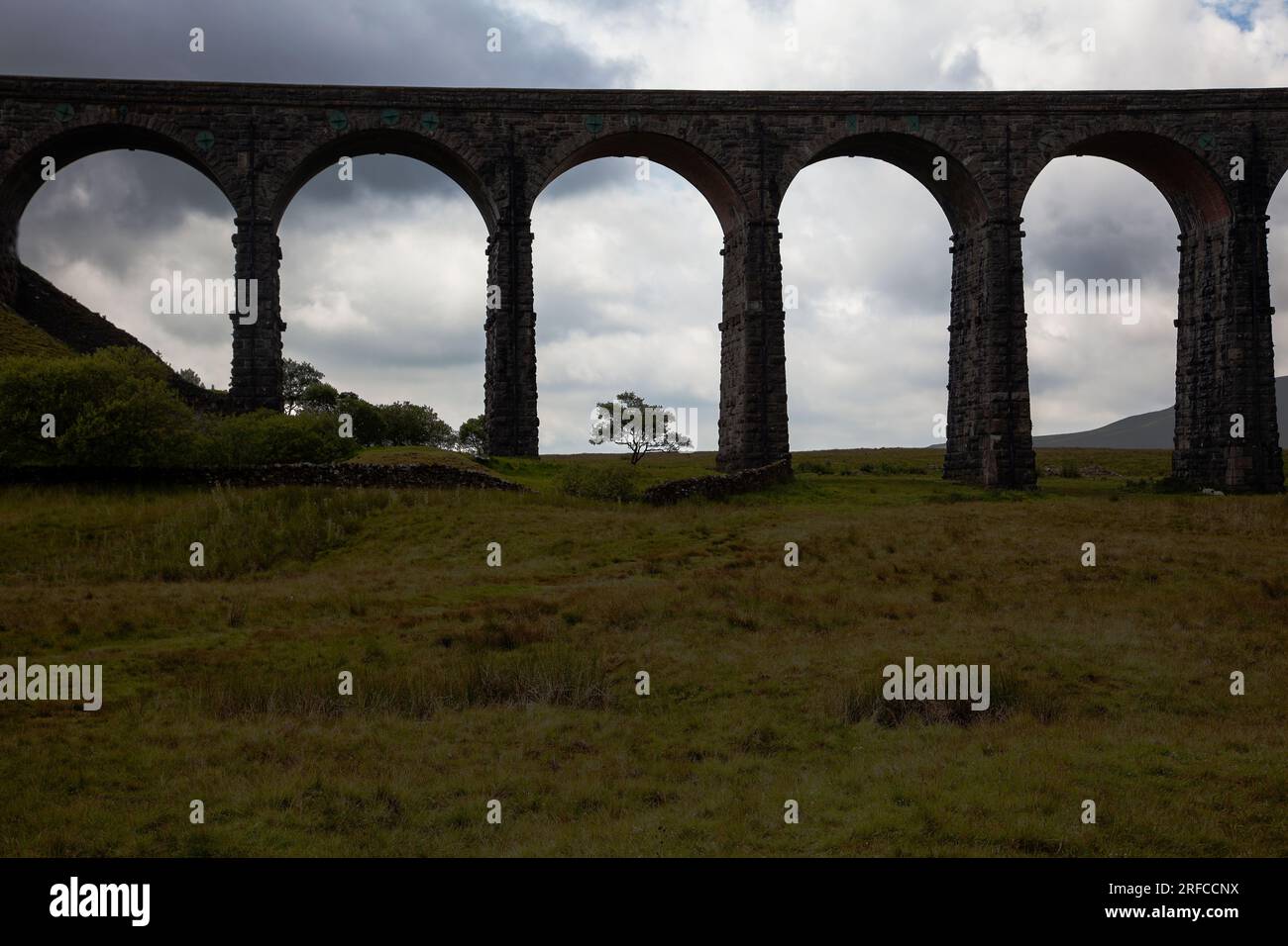 Ribblehead Viaduct at dusk carrying the Settle to Carlisle railway across the Ribble Valley in North Yorkshire Stock Photo
