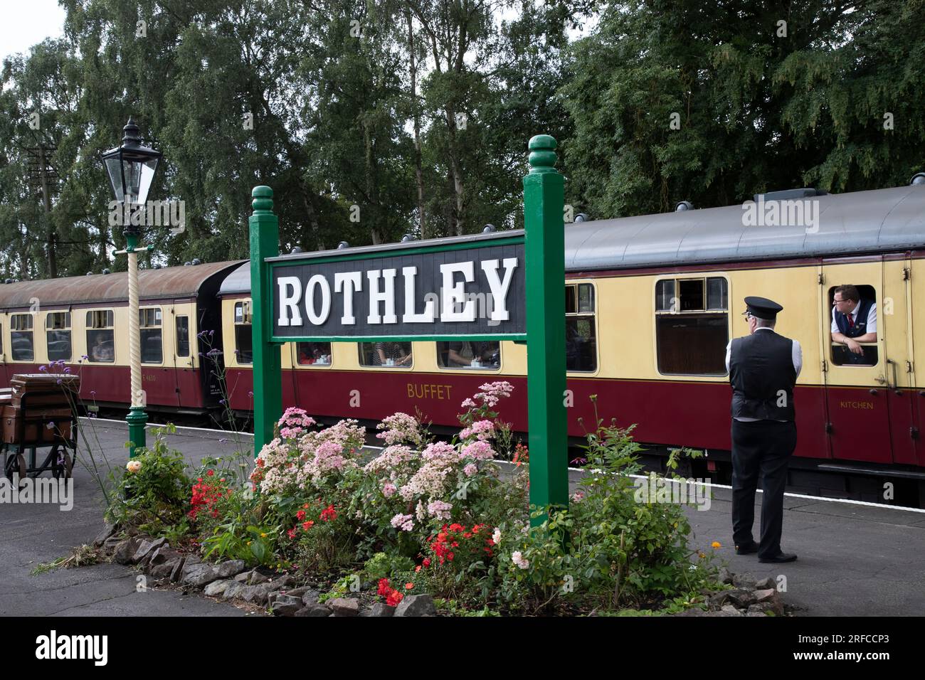 A heritage steam hauled train arrives at Rothley station on the Great Central Railway preservation line en route from Loughborough to Leicester North Stock Photo