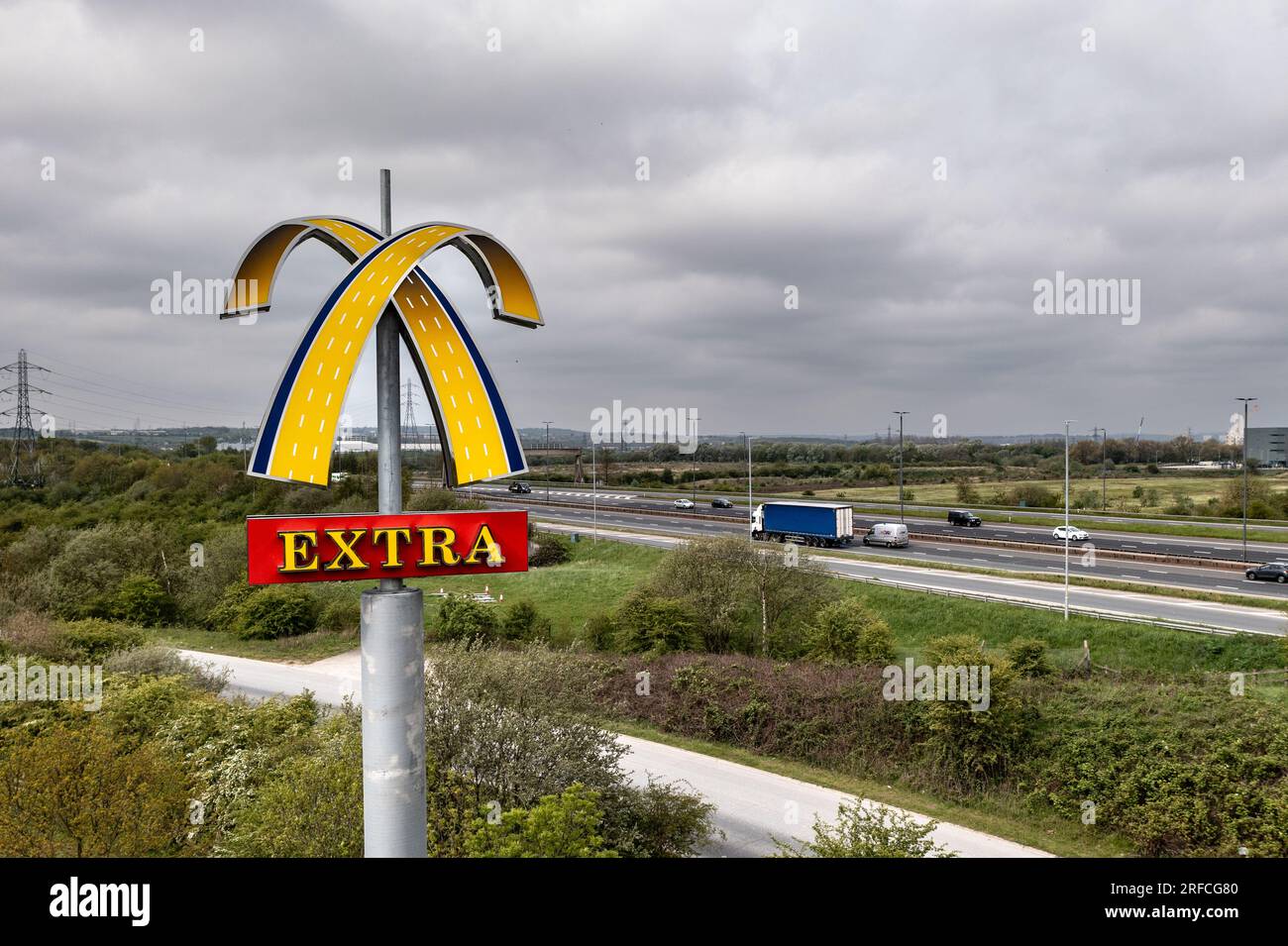 LEEDS, UK - MAY 4, 2023.  A McDonalds Extra Golden Arches sign on a UK Motorway with copy space Stock Photo