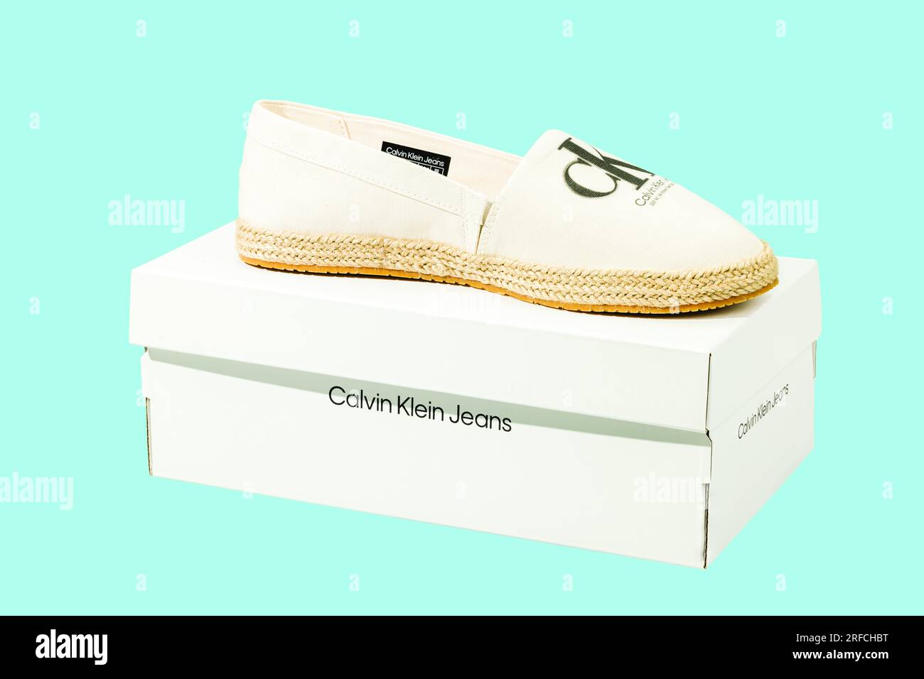 Close-up view of box with Calvin Klein espadrilles sandals isolated on blue  background. Sweden Stock Photo - Alamy