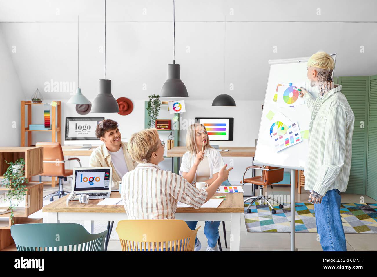 Team of graphic designers working with color palettes in office Stock Photo