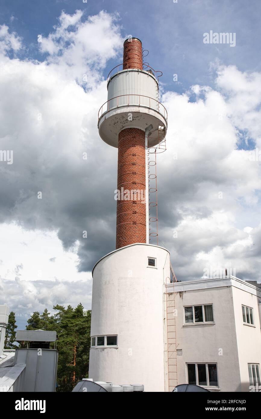 Mounted water tower on smokestack at Paimio Sanatorium, former tuberculosis hospital designed by Aino and Alvar Aalto, in Paimio, Finland Stock Photo