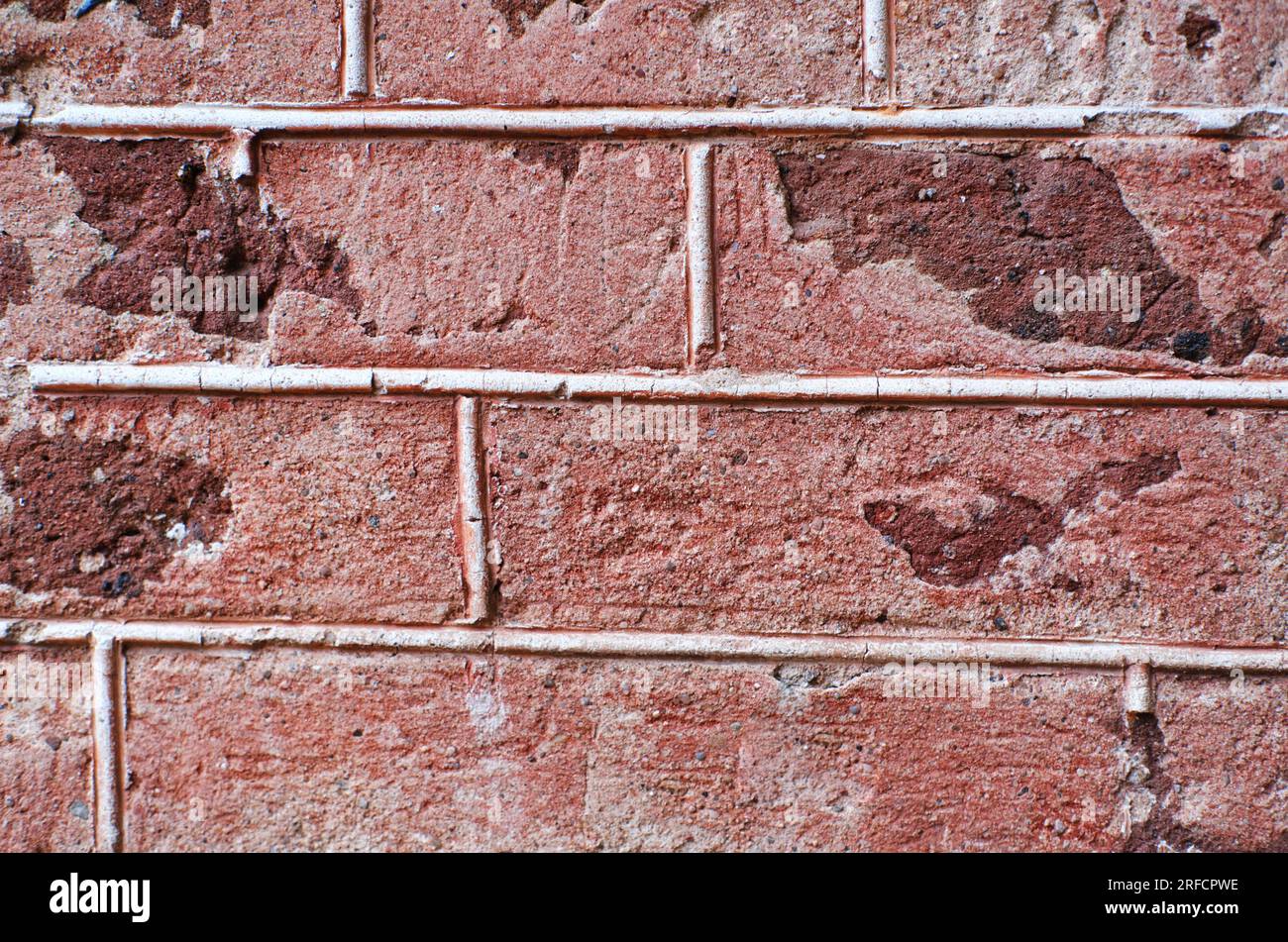 background red wall bricks with cement closeup. Horizontal photo Stock Photo