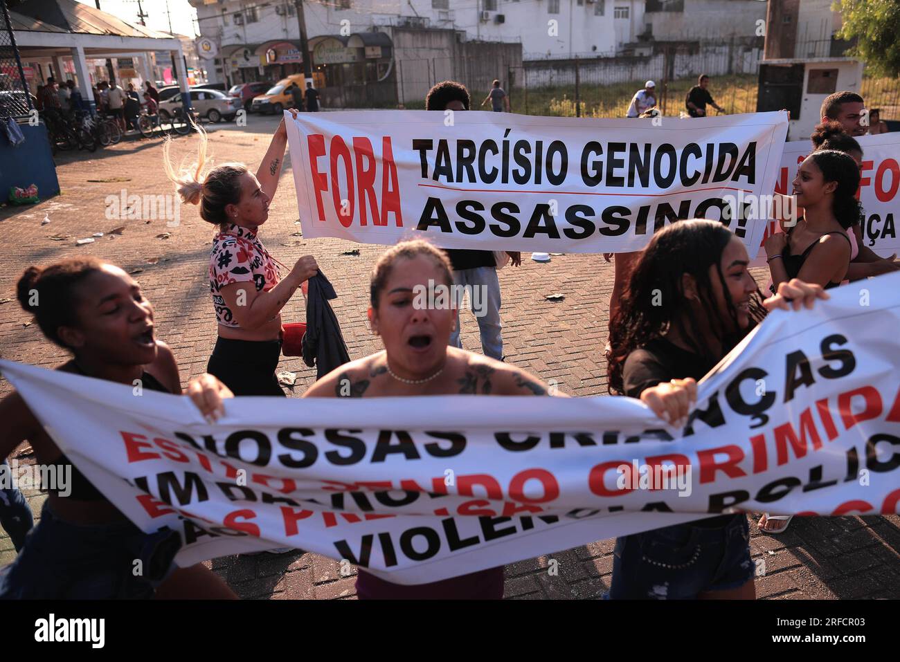 SP - GUARUJA - 08/02/2023 - GUARUJA, OPERATION ESCUDO - Protesters are seen with signs with the words &#x201c;Out! Tarcisio genocidal, murderer&#x201d; during an act against Operation Escudo, in Vicente de Carvalho, district of the city of Guaruja, this Wednesday (02). The Sao Paulo military police launched Operation Shield, strengthening policing and resulting in deaths in the cities of Santos and Guaruja in the Baixada Santista after a military police officer from ROTA, an elite troop of the Sao Paulo military police, was killed by a shotgun blast. fire during city tour. Photo: Ettore Chiere Stock Photo