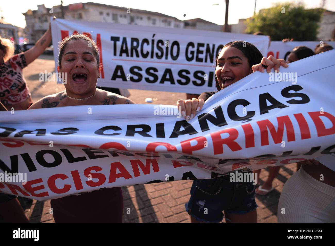 SP - GUARUJA - 08/02/2023 - GUARUJA, OPERATION ESCUDO - Protesters are seen with signs with the words &quot;Out Tarcisio Genocida, Assassin&quot; during an act against Operation Escudo, in Vicente de Carvalho, district of the city of Guaruja, this Wednesday -Friday (02). The Sao Paulo military police launched Operation Shield, strengthening policing and resulting in deaths in the cities of Santos and Guaruja in the Baixada Santista after a military police officer from ROTA, an elite troop of the Sao Paulo military police, was killed by a shotgun blast. fire during city tour. Photo: Ettore Chie Stock Photo