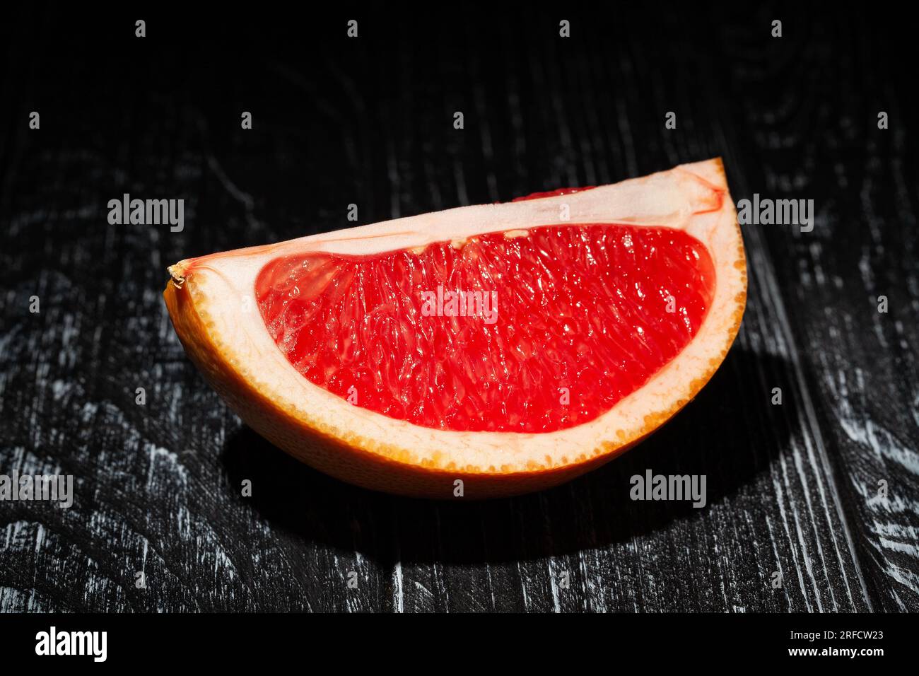 sliced grapefruit on wood background Stock Photo