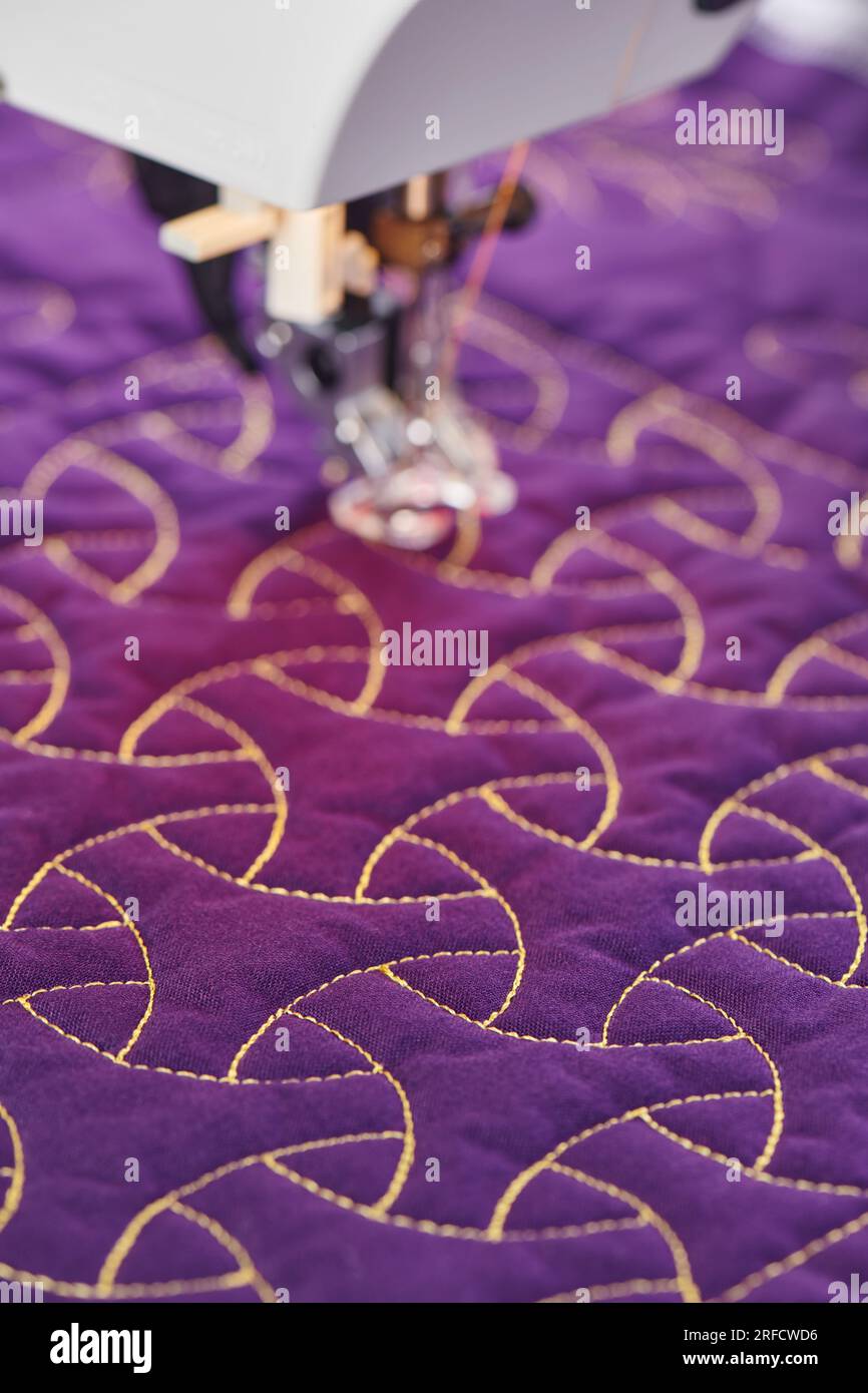 Process quilting with an electric sewing machine by using a freemotion