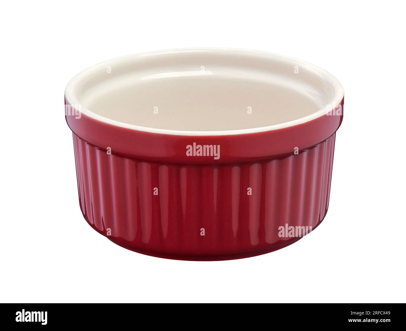 Red round empty porcelain ramekin on a white background Stock Photo