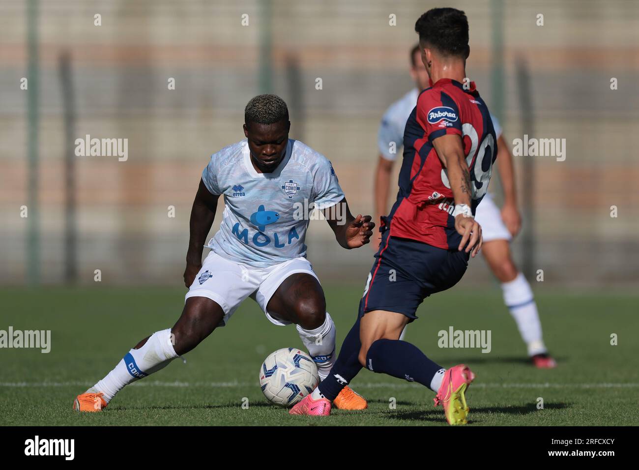 Chatillon, Italy. 2nd Aug, 2023. Ben Kone of Como takes on Alessandro Di Pardo of Cagliari during the Pre Season Friendly match at Stadio Comunale, E. Brunod. Picture credit should read: Jonathan Moscrop/Sportimage Credit: Sportimage Ltd/Alamy Live News Stock Photo