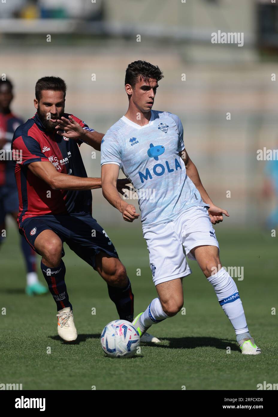 Chatillon, Italy. 2nd Aug, 2023. Leonardo Pavoletti of Cagliari challenges Can Odenthal of Como during the Pre Season Friendly match at Stadio Comunale, E. Brunod. Picture credit should read: Jonathan Moscrop/Sportimage Credit: Sportimage Ltd/Alamy Live News Stock Photo