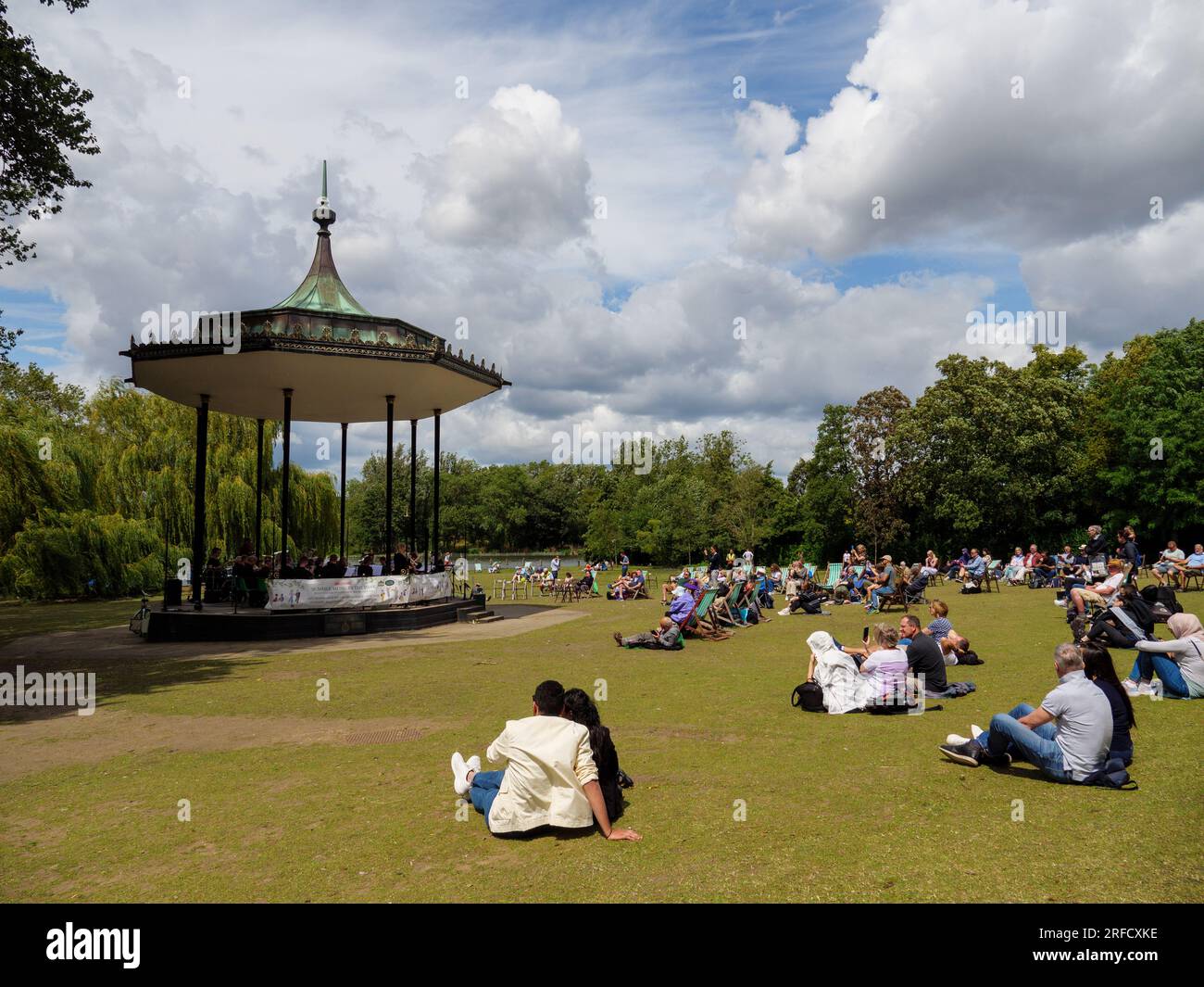 People listening to the music at a bandstand in Regent’s Park, London UK Stock Photo