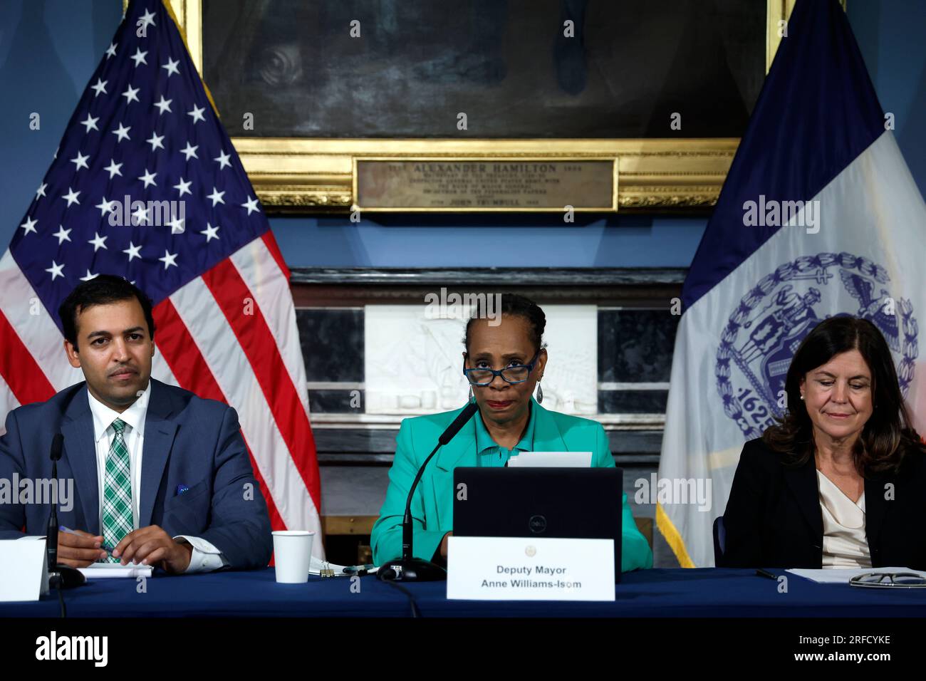 NYC Deputy chief council Rahul Agarwal (C-left) and NYU Provost Georgina Dopico (C-Right) joinNew York City Deputy Mayor for health and human services Anne Williams-Isom as she holds a briefing on the city's response about asylum seekers at City Hall on August 2, 2023 in New York City, USA. In the absence of a national strategy the Deputy Mayor outlined several current city programs that will enable migrants to gain shelter, education and work visas. However, the city cannot continue to absorb thousands of newcomers on its own; “ the country needs to step up” and share in the burden. (Photo b Stock Photo