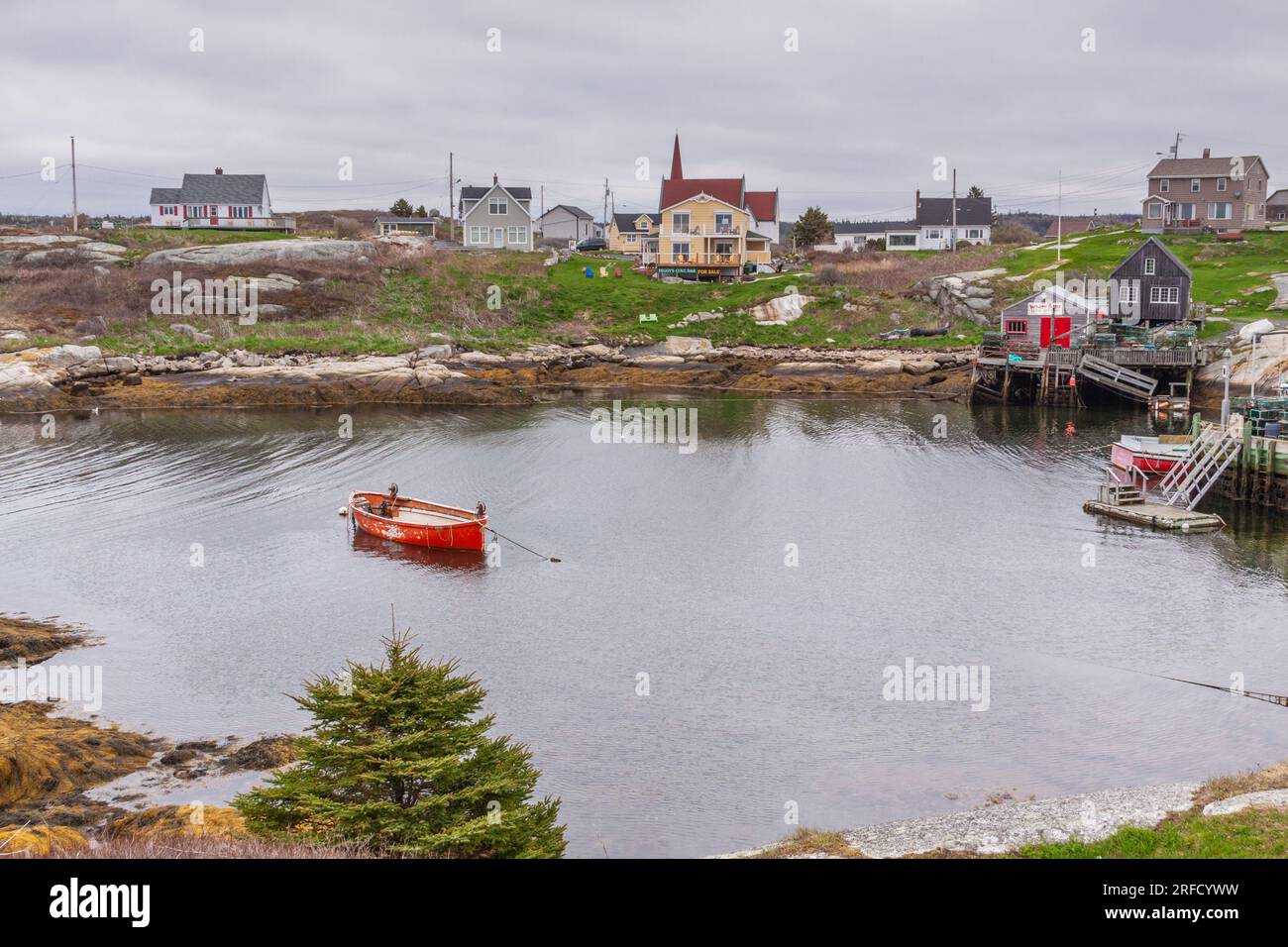 Fishing boat on a cold, rainy day at Peggy's Cove near Halifax, Nova Scotia, Canada. Stock Photo