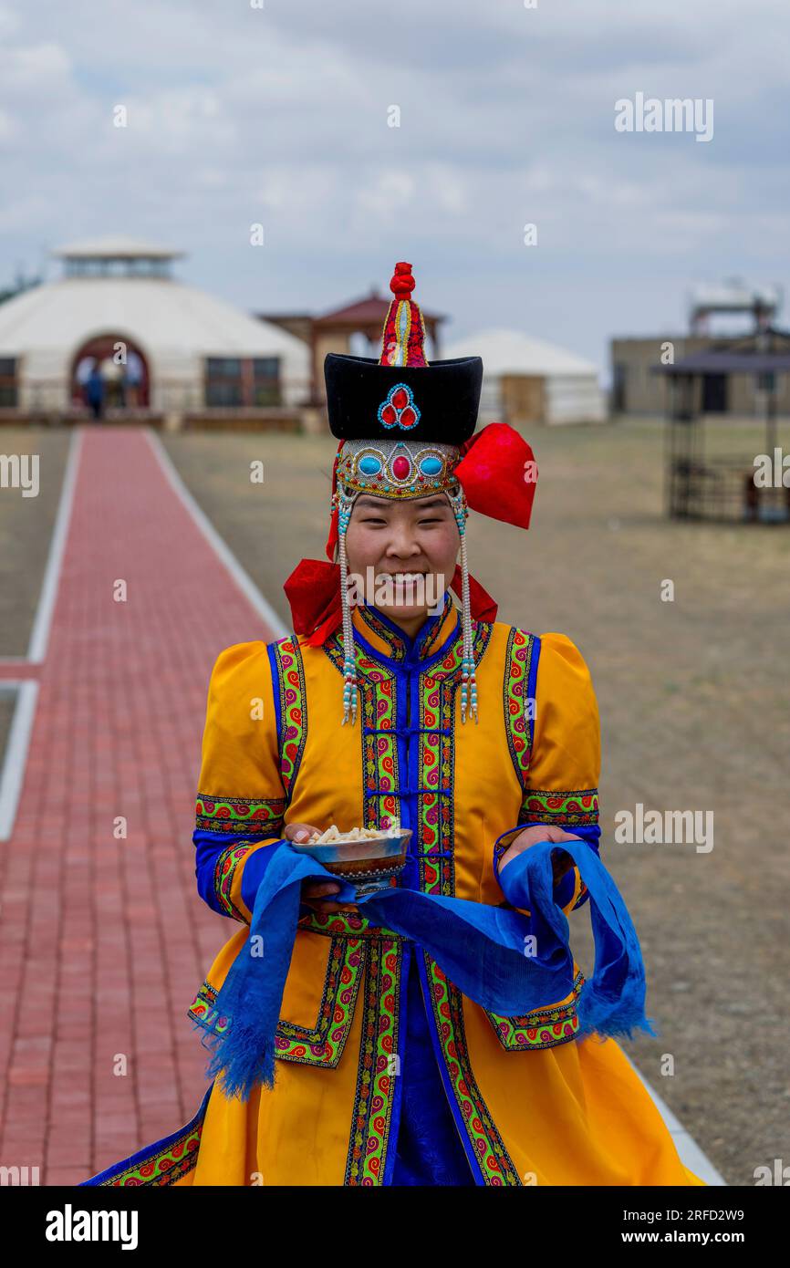 A Mongolian young woman in traditional dress at the Gobi Mirage lodge ...