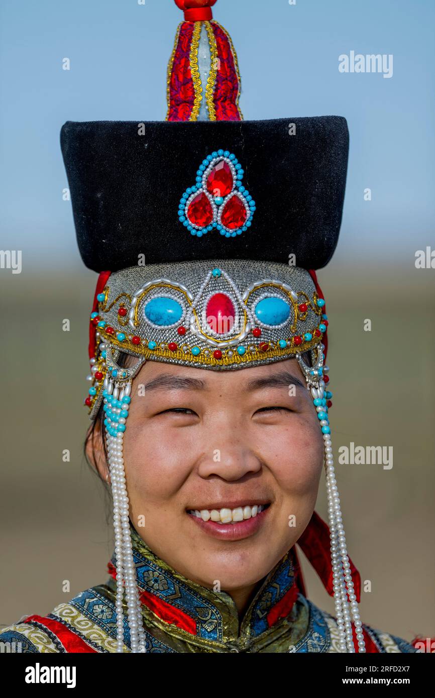 A Mongolian young woman in traditional dress at the Gobi Mirage lodge ...