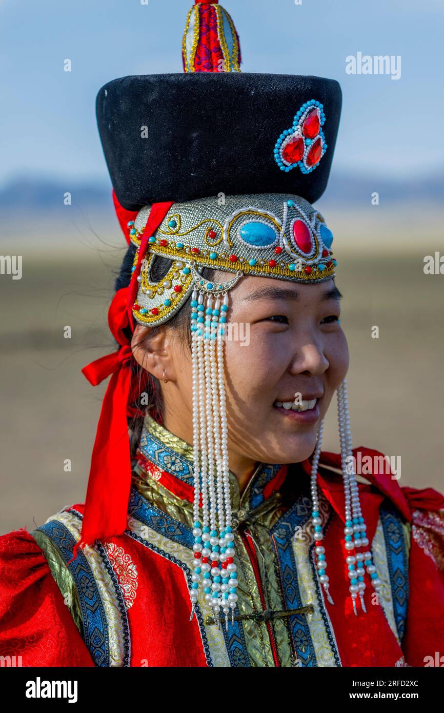 A Mongolian young woman in traditional dress at the Gobi Mirage lodge ...