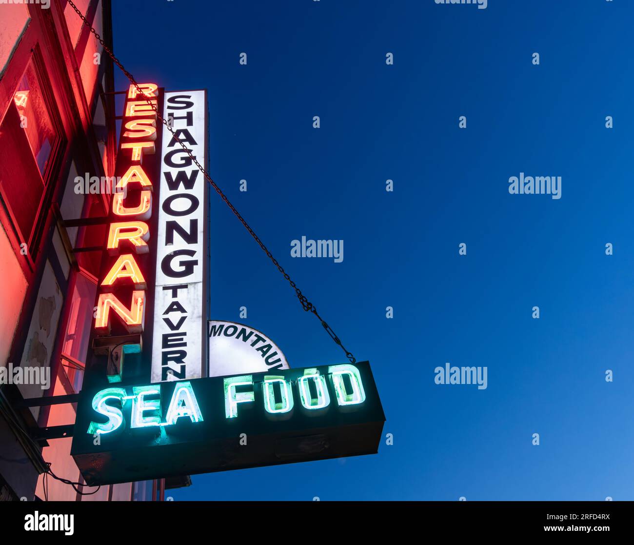 the signs for the Shagwond Tavern in Montauk at night Stock Photo