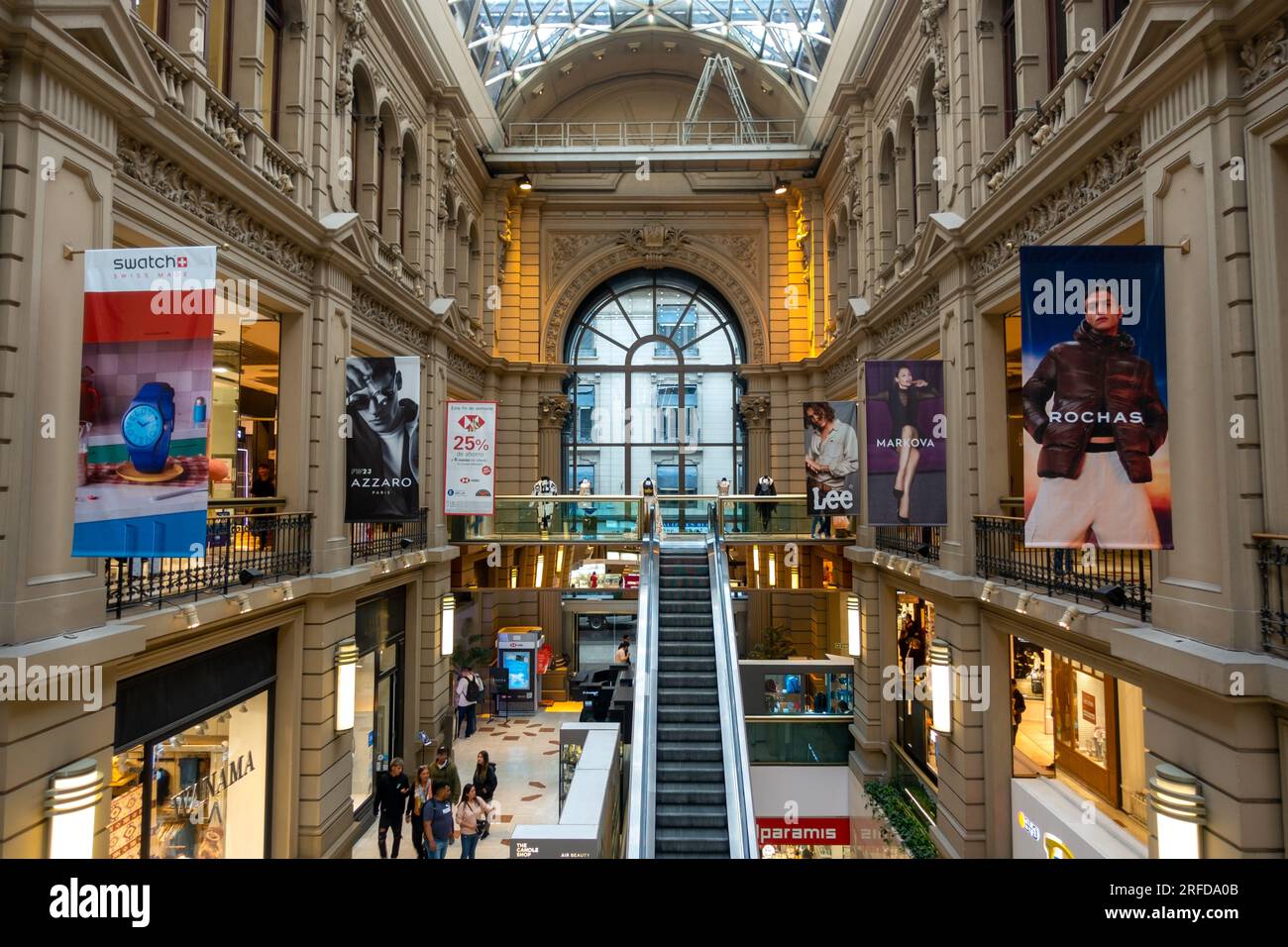 Shoppers Browsing High End Department Stores in Galerias Pacifico, Modern Shopping Mall Center Interior in Buenos Aires, Argentina City Center Stock Photo