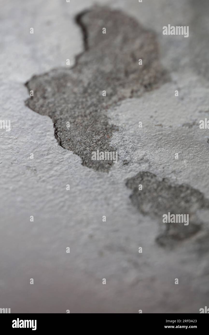 Old white wall with damaged plaster close up buildings surfaces background shattered cement big size high quality instant stock photography printing v Stock Photo