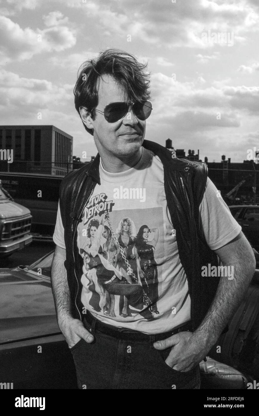 Commedian/Actor Dan Aykroyd on set in 1982. Bernard Gotfryd photograph. Daniel Edward Aykroyd is a Canadian actor, comedian, screenwriter, producer, and musician. Aykroyd was a writer and an original member of the 'Not Ready for Prime Time Players' cast on the NBC sketch comedy series Saturday Night Live from its inception in 1975 until his departure in 1979. During his tenure on SNL, he appeared in a recurring series of sketches, particularly featuring the Coneheads and the Blues Brothers. Stock Photo