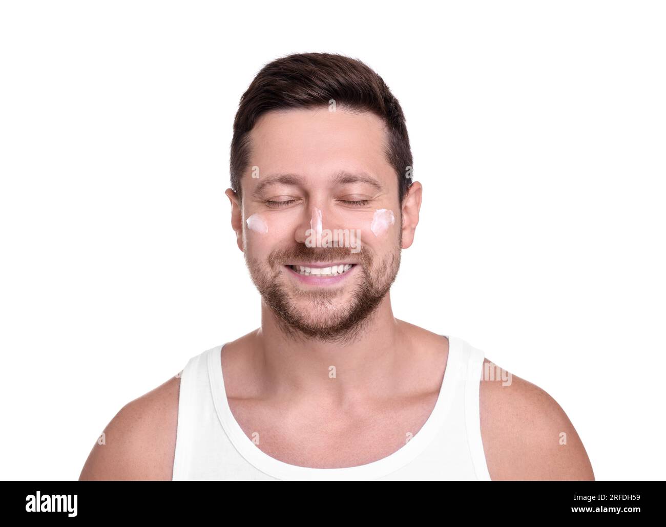 Handsome man with sun protection cream on his face against white background Stock Photo