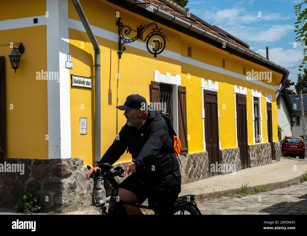 A cyclist rides through the town of Szentendre in Pest County, Hungary. Stock Photo