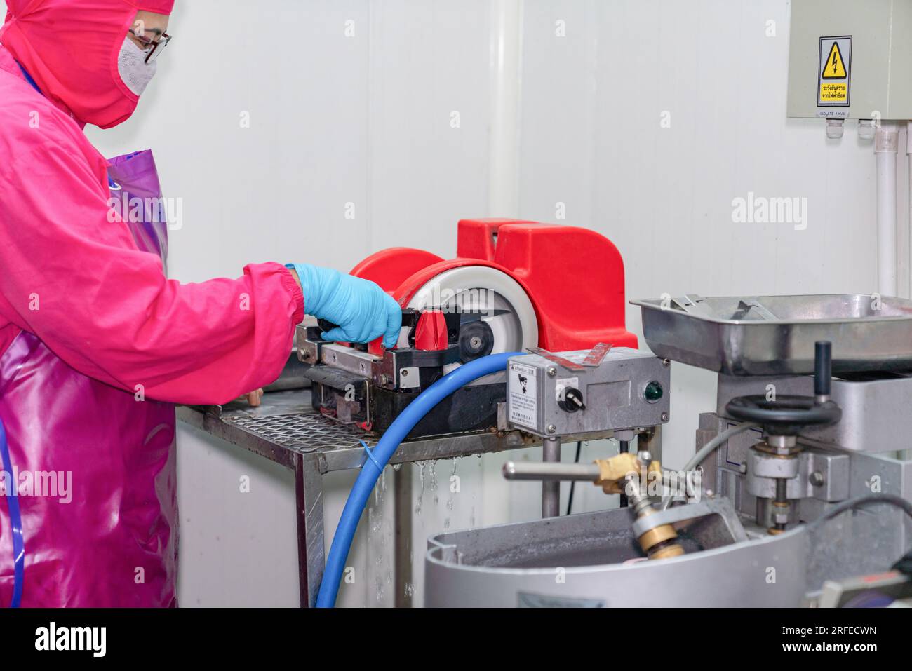 knife sharpening machine and master. Grinding machine. grinding knife using  abrasive stone Stock Photo - Alamy