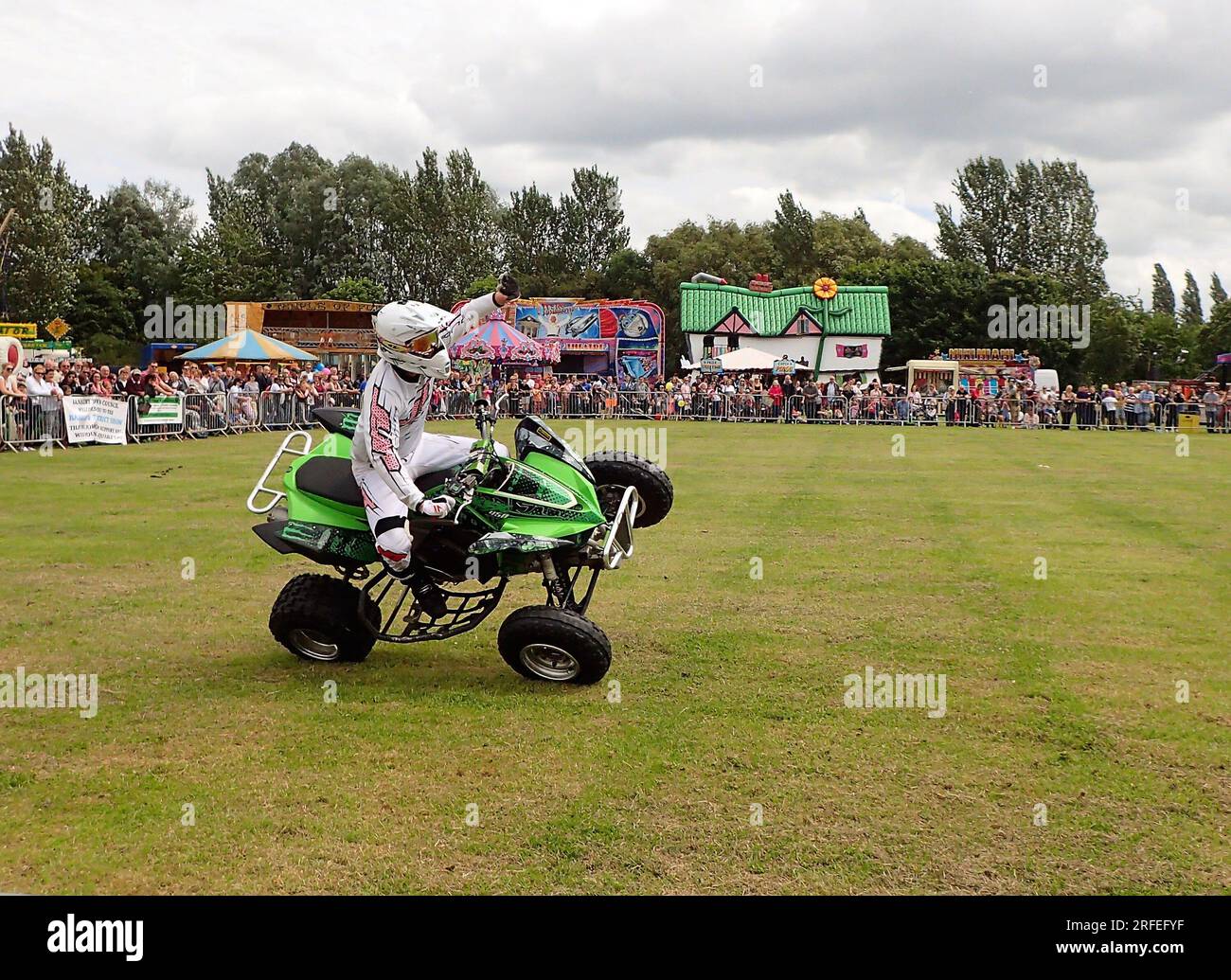 Rider pops a wheelie in Stunt Mania show at the Banbury & District Show in Spiceball Park, Banbury, UK Stock Photo