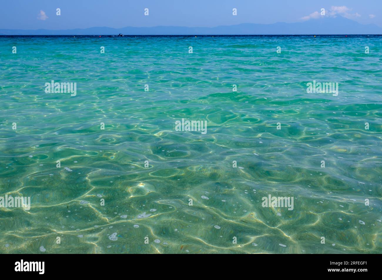 Close up view of the beautiful crystal clear turquoise  beach of Armenistis Camping in Chalkidiki  Greece Stock Photo