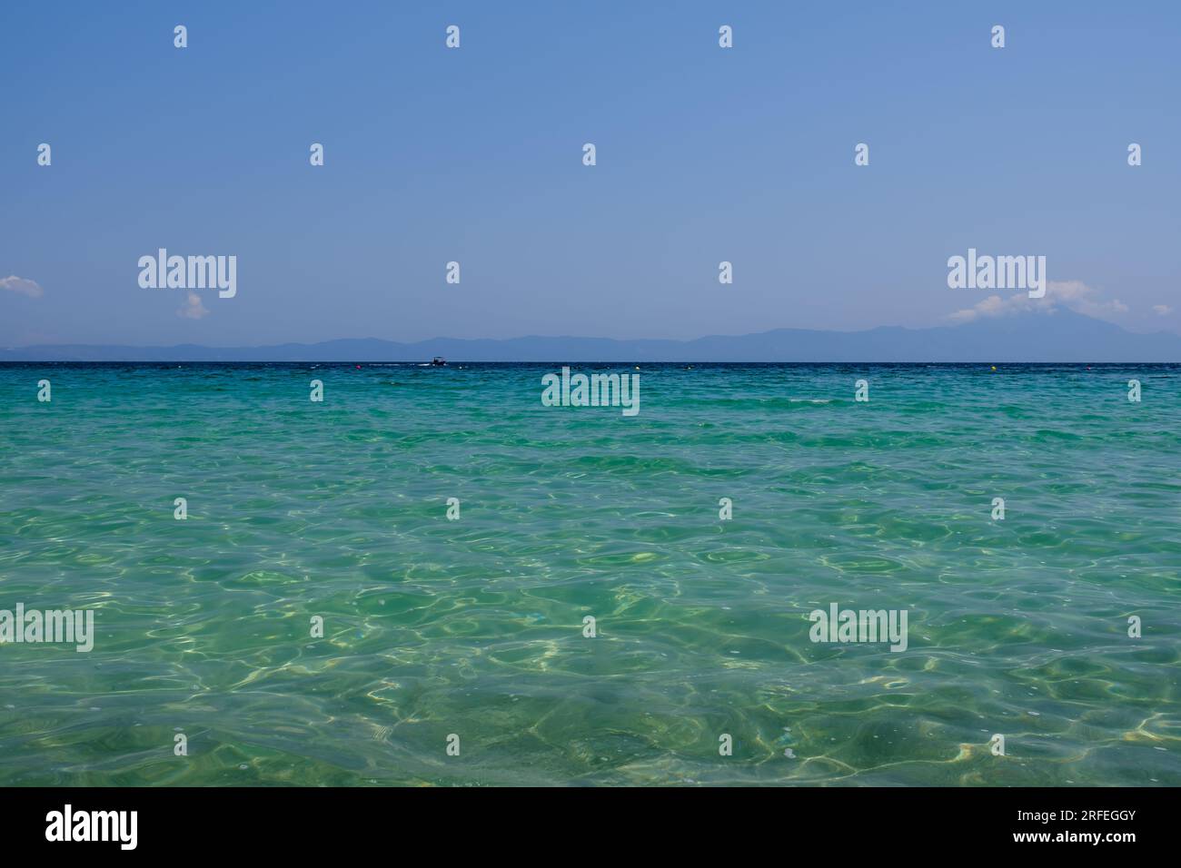 View of the beautiful sandy and crystal clear turquoise  beach of Armenistis Camping in Chalkidiki  Greece Stock Photo