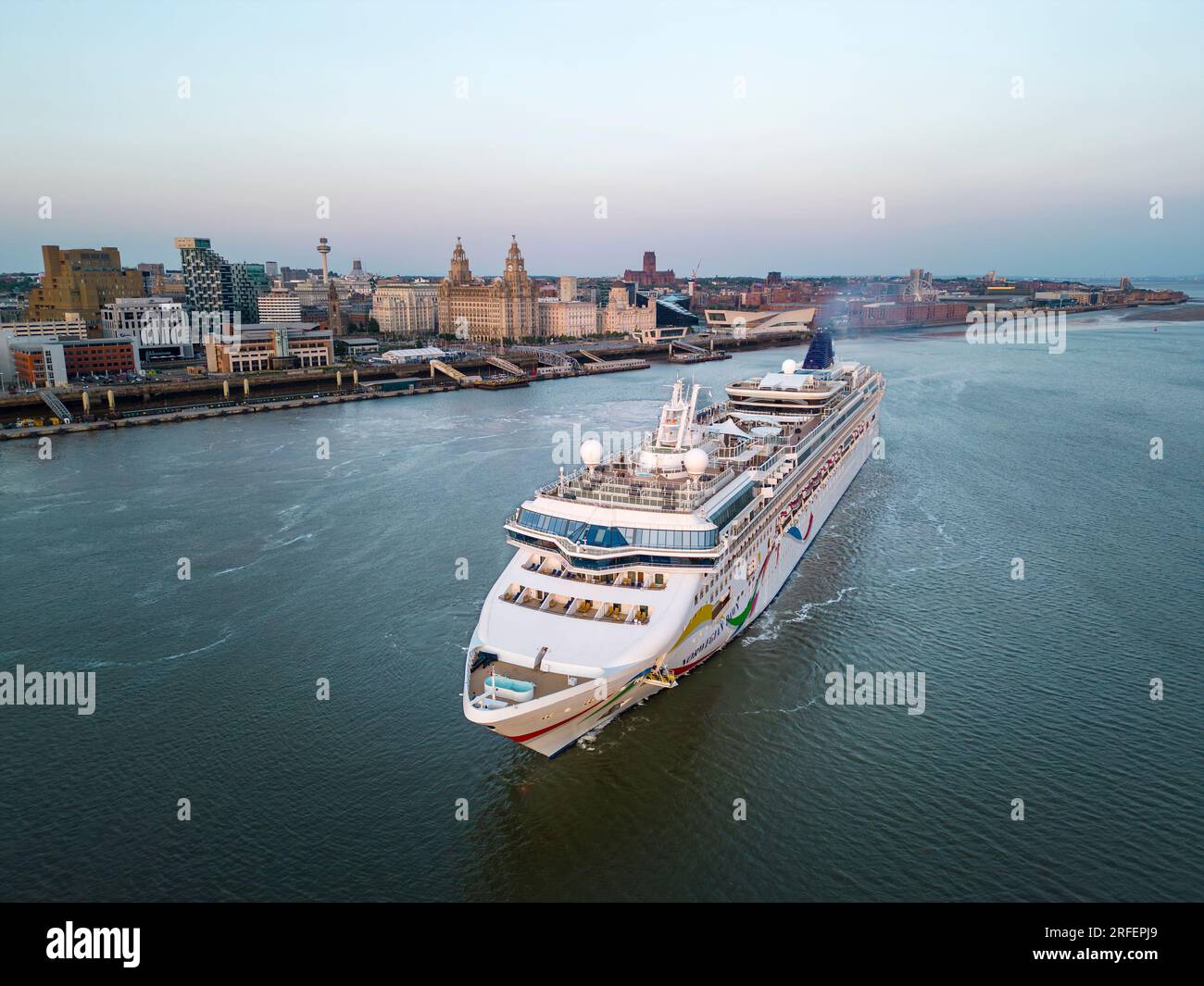 Norwegian Dawn cruise ship sails down the River Mersey, Liverpool, England Stock Photo
