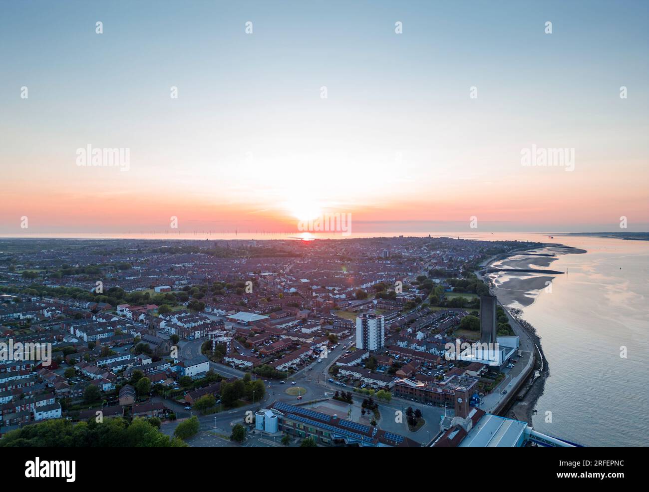 Wallasey town on the Wirral alongside the River Mersey at sunset, Merseyside, England Stock Photo