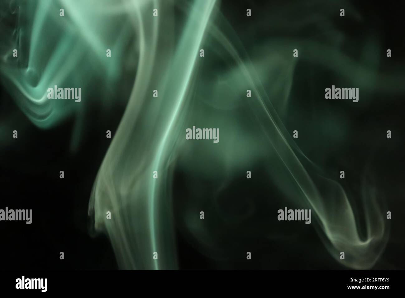 Green smoke on a dark background, patterns Stock Photo